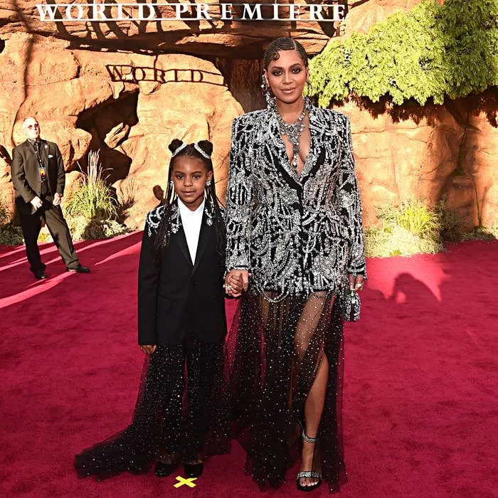 Young Blue Ivy Carter and Beyonce Knowles-Carter on a red carpet